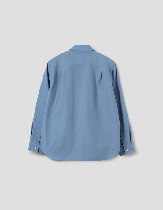Blue cotton long sleeve shirt, with mother of pearl button cuffs and pleats on back yoke. Back flat lay view.