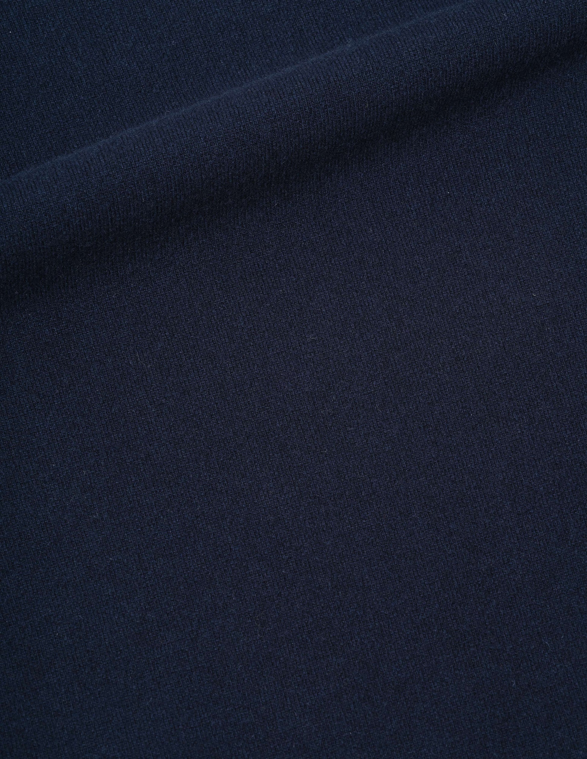 Dark blue merino cashmere knitted sweatshirt fabric swatch.