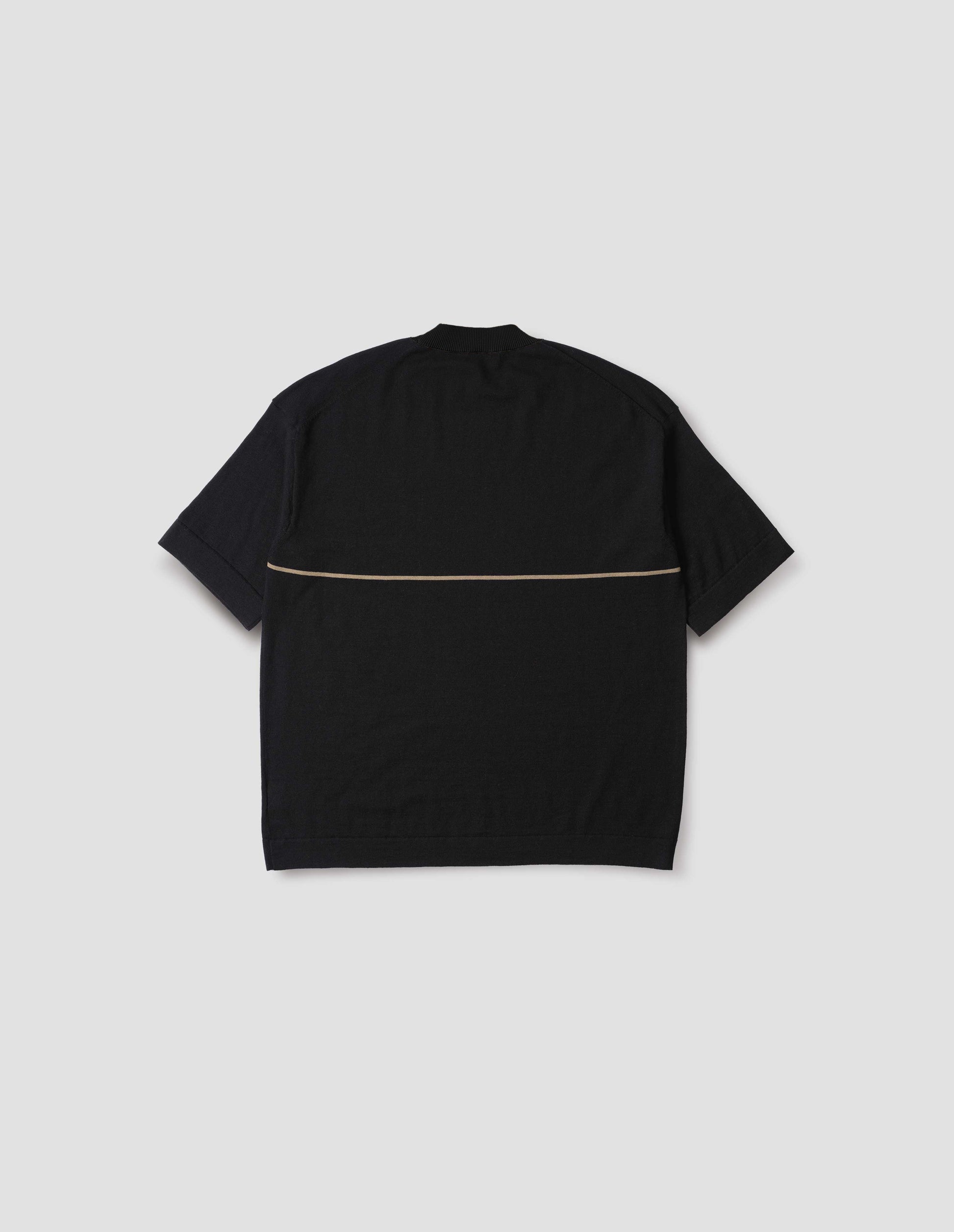 Black knitted t-shirt with deep rib crew neck, set in sleeves and single dark beige stripe across body. Back flat lay view.