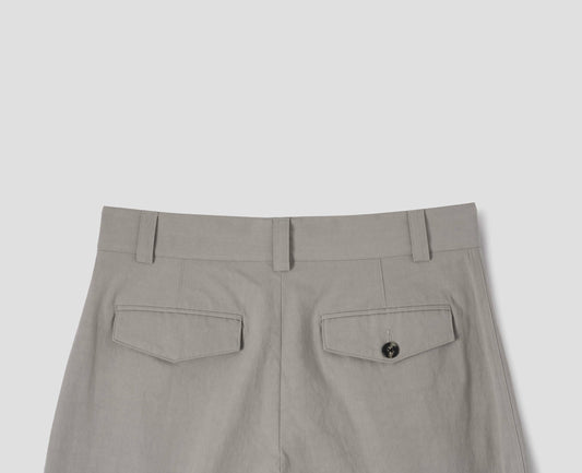 Light grey cotton trousers, with belt loops and concealed flap and button-through jet back pockets. Back flat lay view.