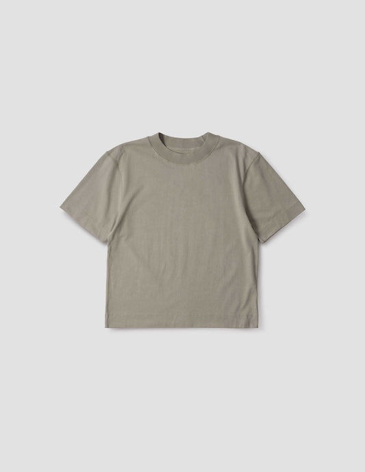 Greenish beige short sleeve t-shirt with dropped shoulder and rib neck. Front flat lay view.