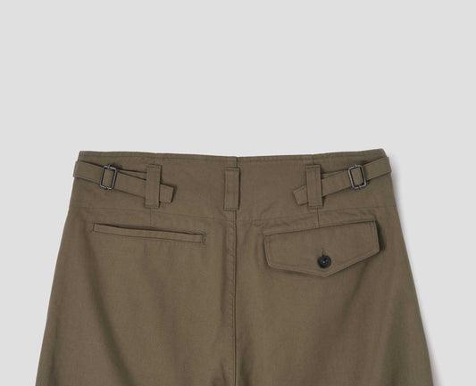 Green cotton drill trousers with belt loops, side adjustors, welt back and flap back pockets. Back flat lay view.