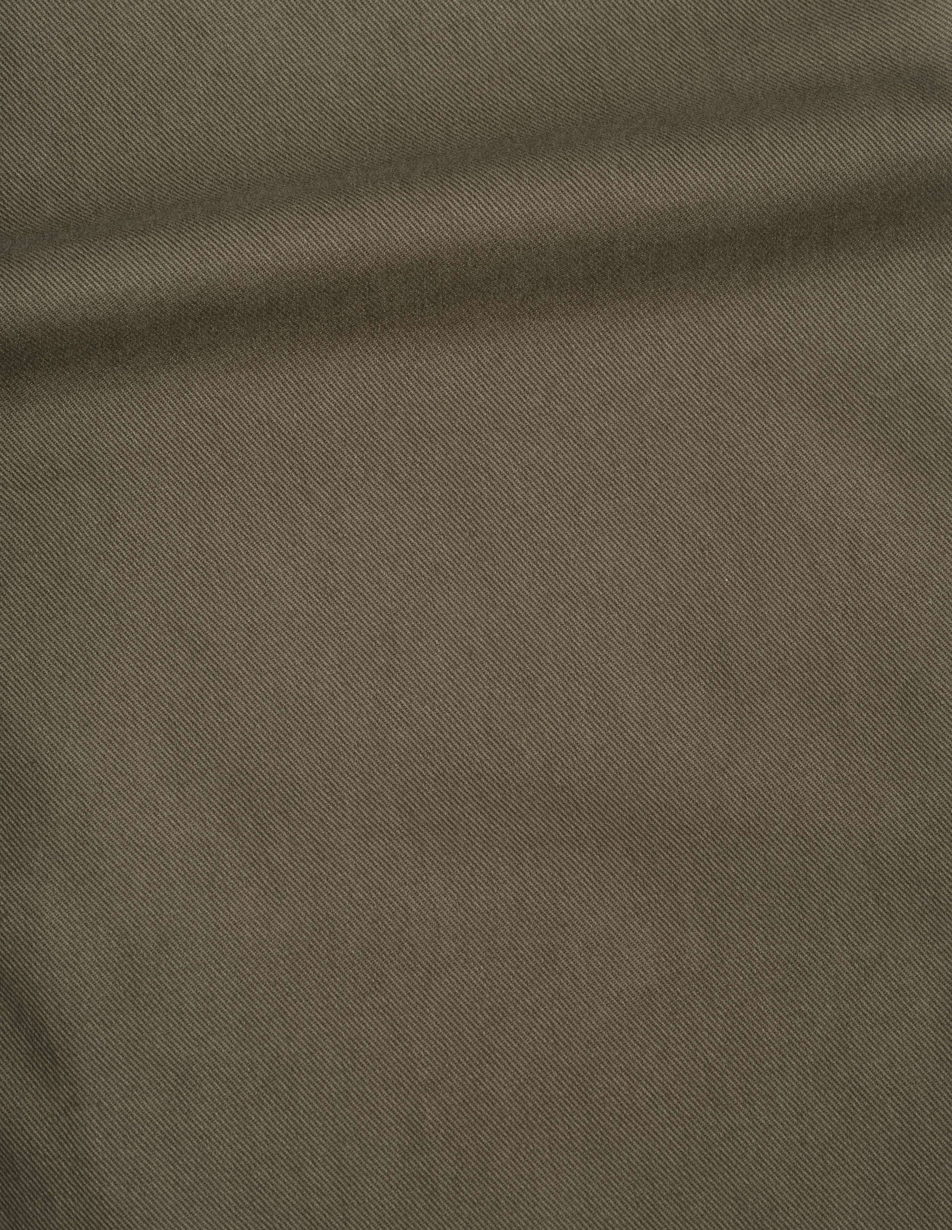 Green soft cotton drill trouser, fabric swatch. 