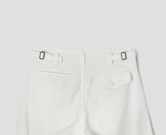 White cotton drill trousers with belt loops, side adjustors, welt back and flap back pockets. Back flat lay view.