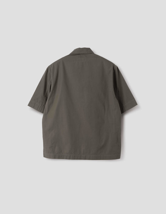 Greyish brown short-sleeved shirt with vent split hem. Back flat lay view. 