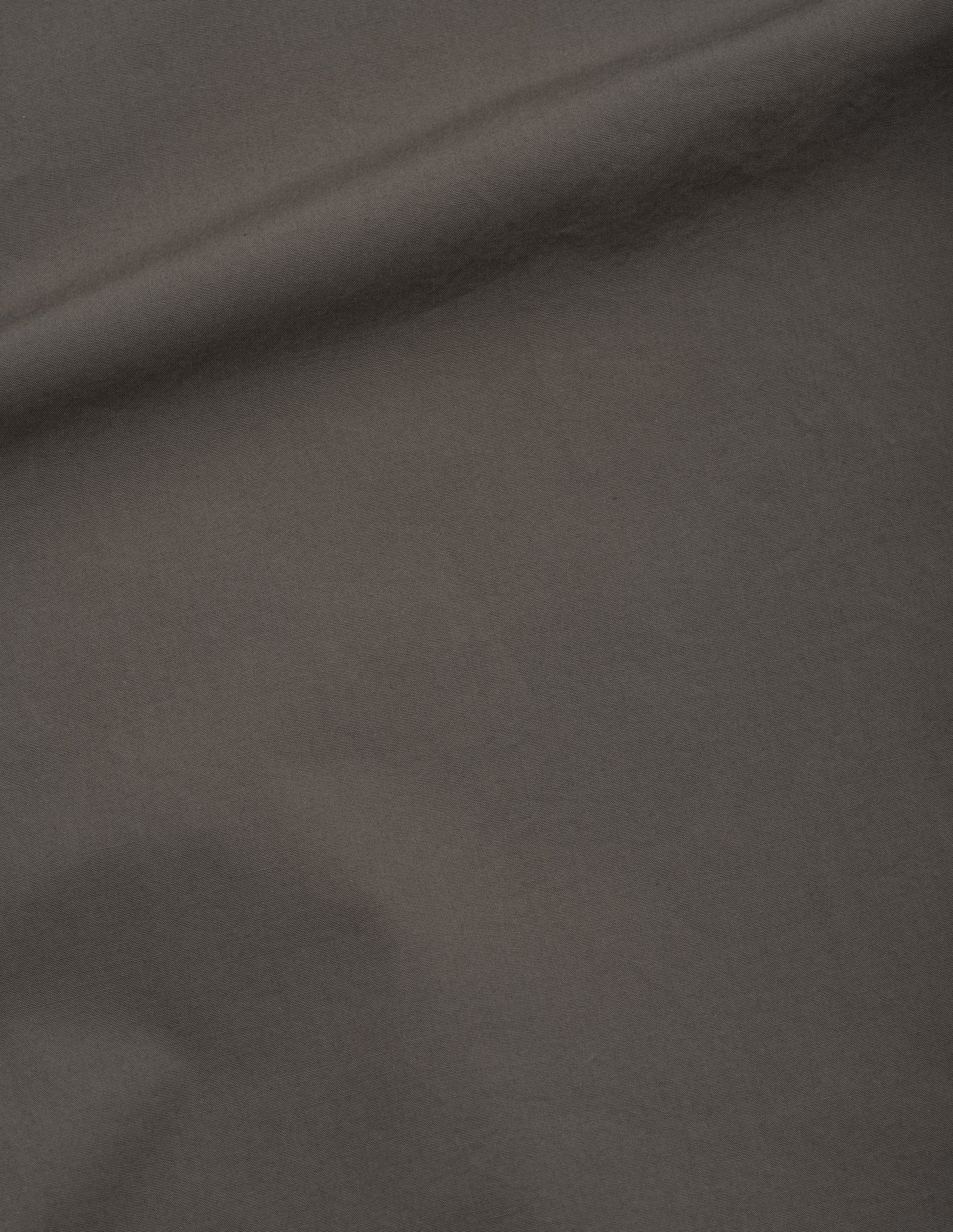 Greyish brown washed cotton poplin shirt, fabric swatch. 