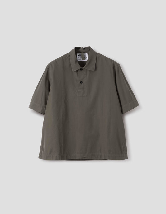 Greyish brown short-sleeved shirt with corozo brace buttons on wide offset placket and vent split hem. Front flat lay view.