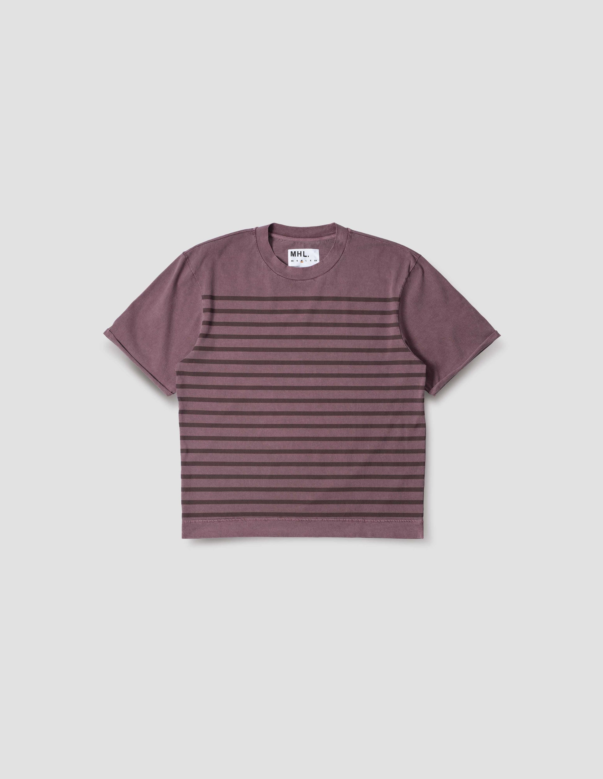 Purple short sleeve cotton t-shirt with brown stripes, flatlock stitch seam detailing and rolled raw sleeve hems held with a single bar tack. Front flat lay view.
