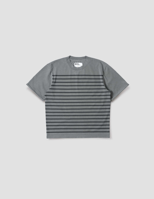 Blueish grey short sleeve t shirt with black stripes, flatlock stitch seam detailing and rolled raw sleeve hems held with a single bar tack. Front flat lay view. 
