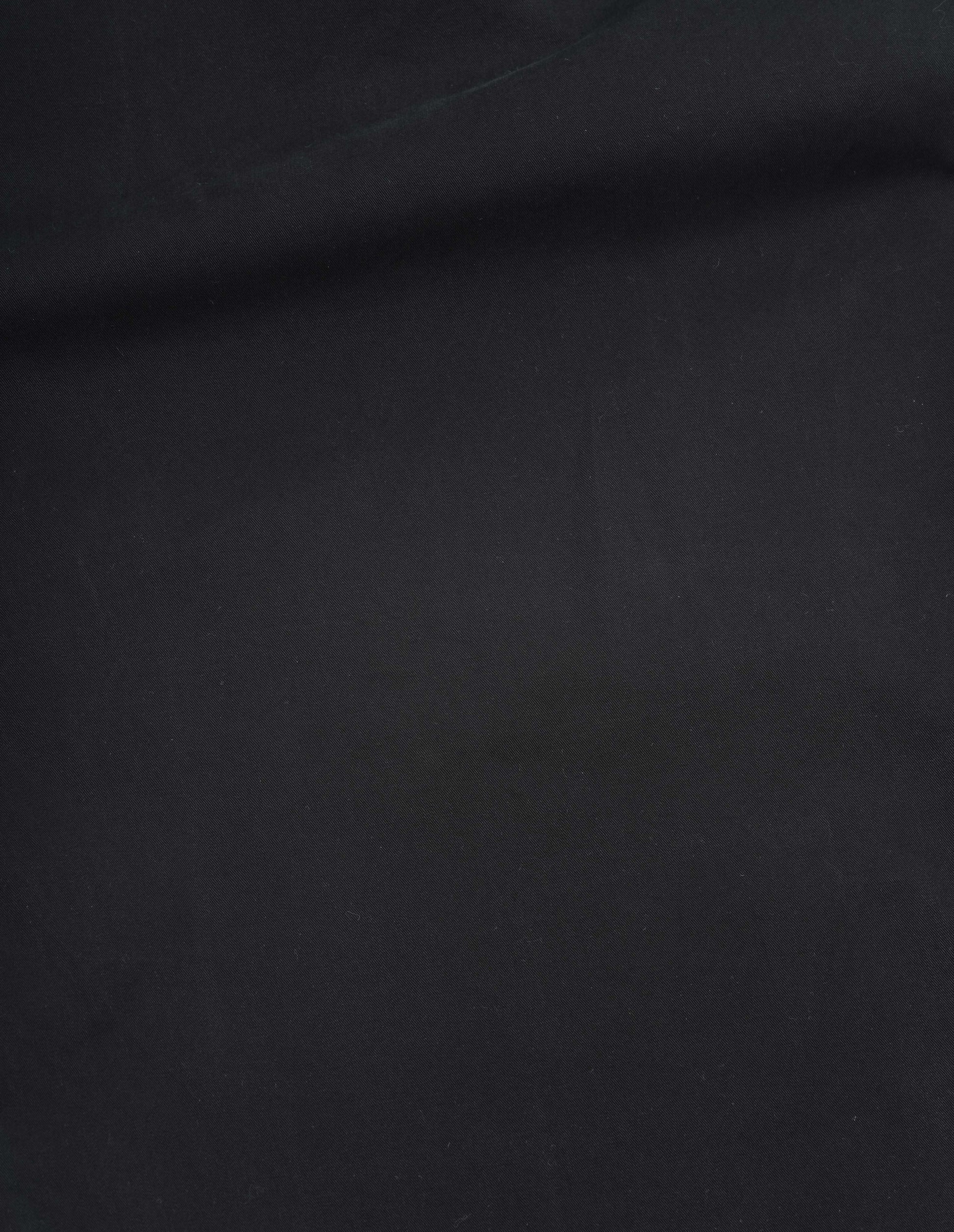 Black matte cotton twill trousers fabric swatch.