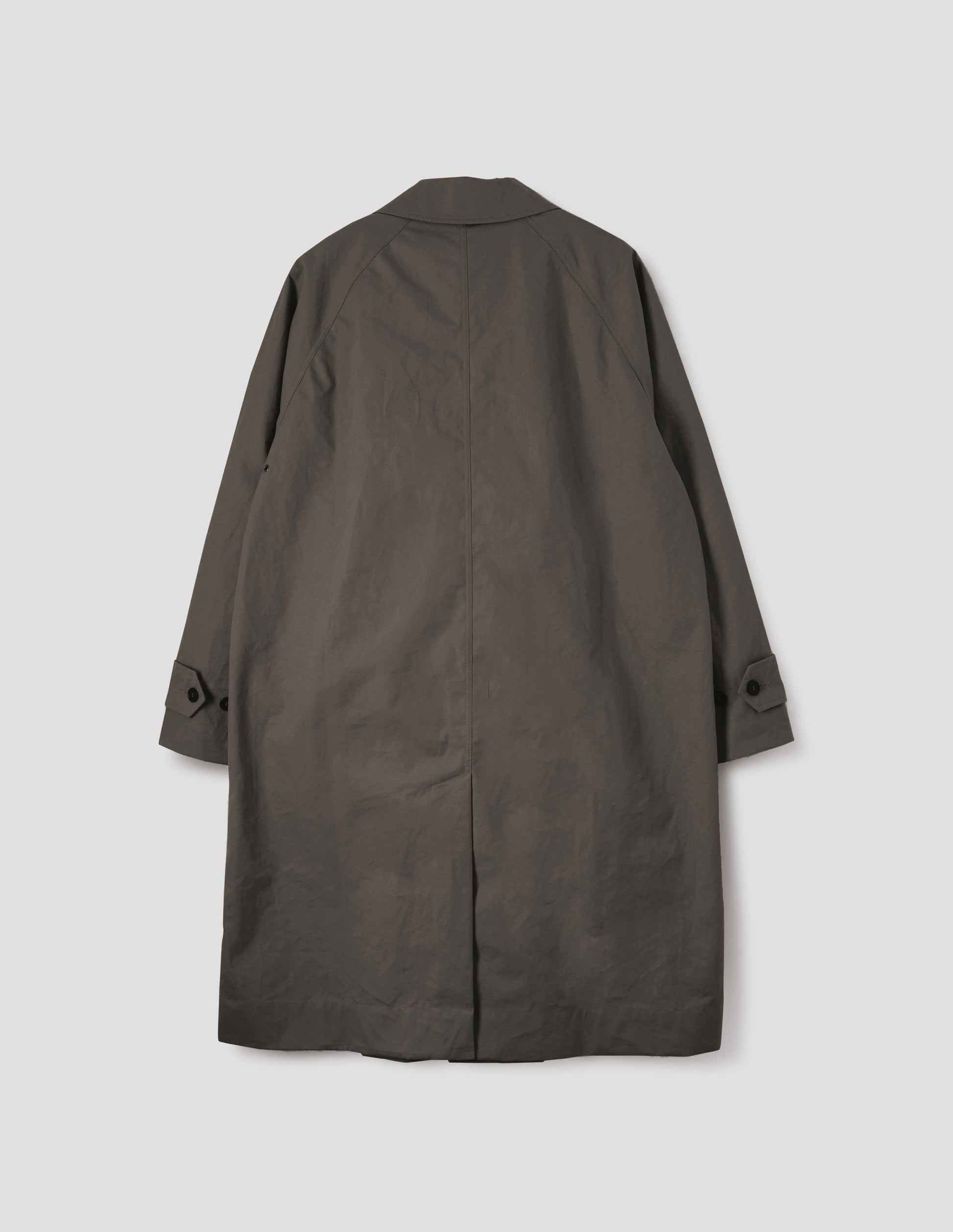 Greyish brown long sleeve cotton mac, with raglan sleeve, button tab adjustable cuffs and rear vent. Back flat lay view.
