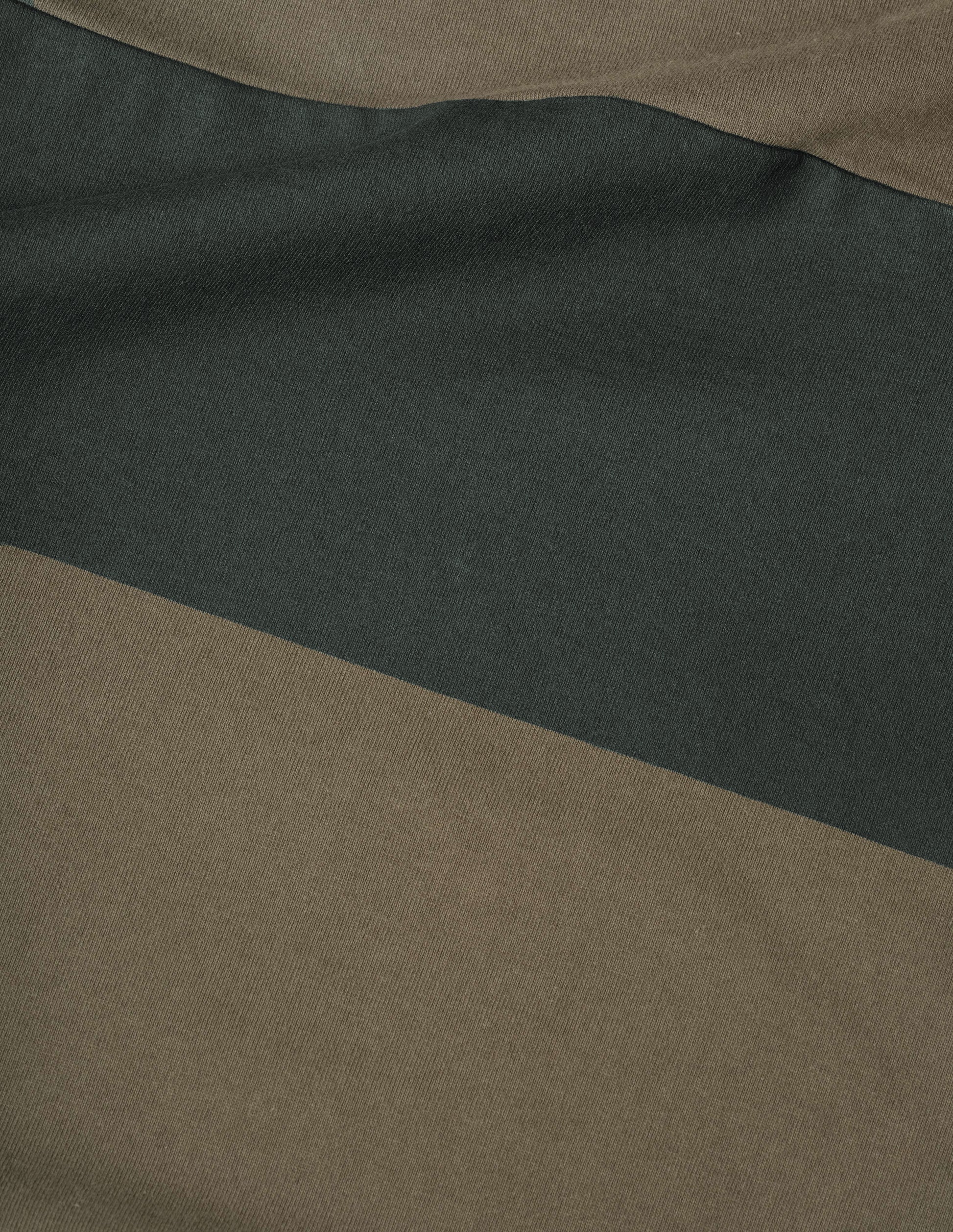 Dark green and black matte jersey long sleeve rugby shirt, fabric swatch.