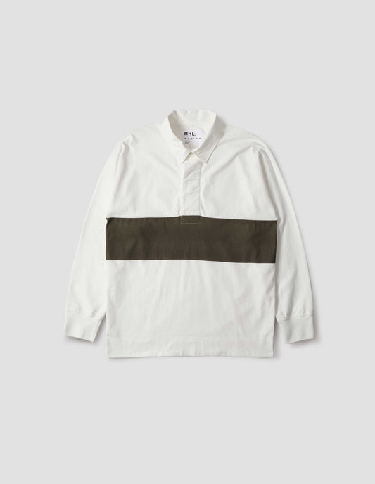 Off white rugby long sleeve polo shirt with dark green panel across chest, twill collar, wide fly front placket and rib cuffs. Front flat lay view. 