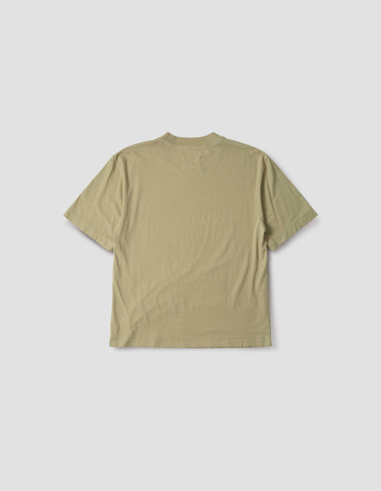 Pale green cotton linen short sleeve t-shirt with vent split hem. Back flat lay view.