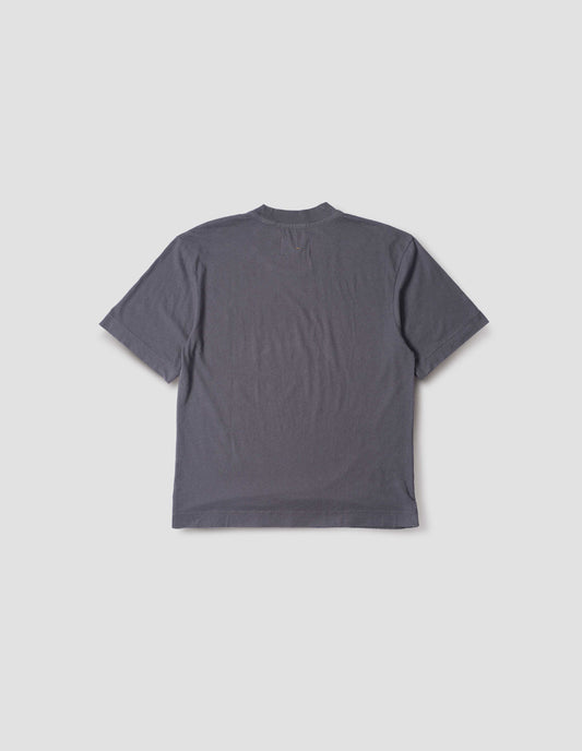 Greyish blue cotton linen short sleeve t-shirt with vent split hem. Back flat lay view.