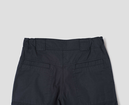 Dark navy blue trousers with elasticated waistband, wide belt loops and stitch through welt pockets on the back yoke. Back flat lay view.