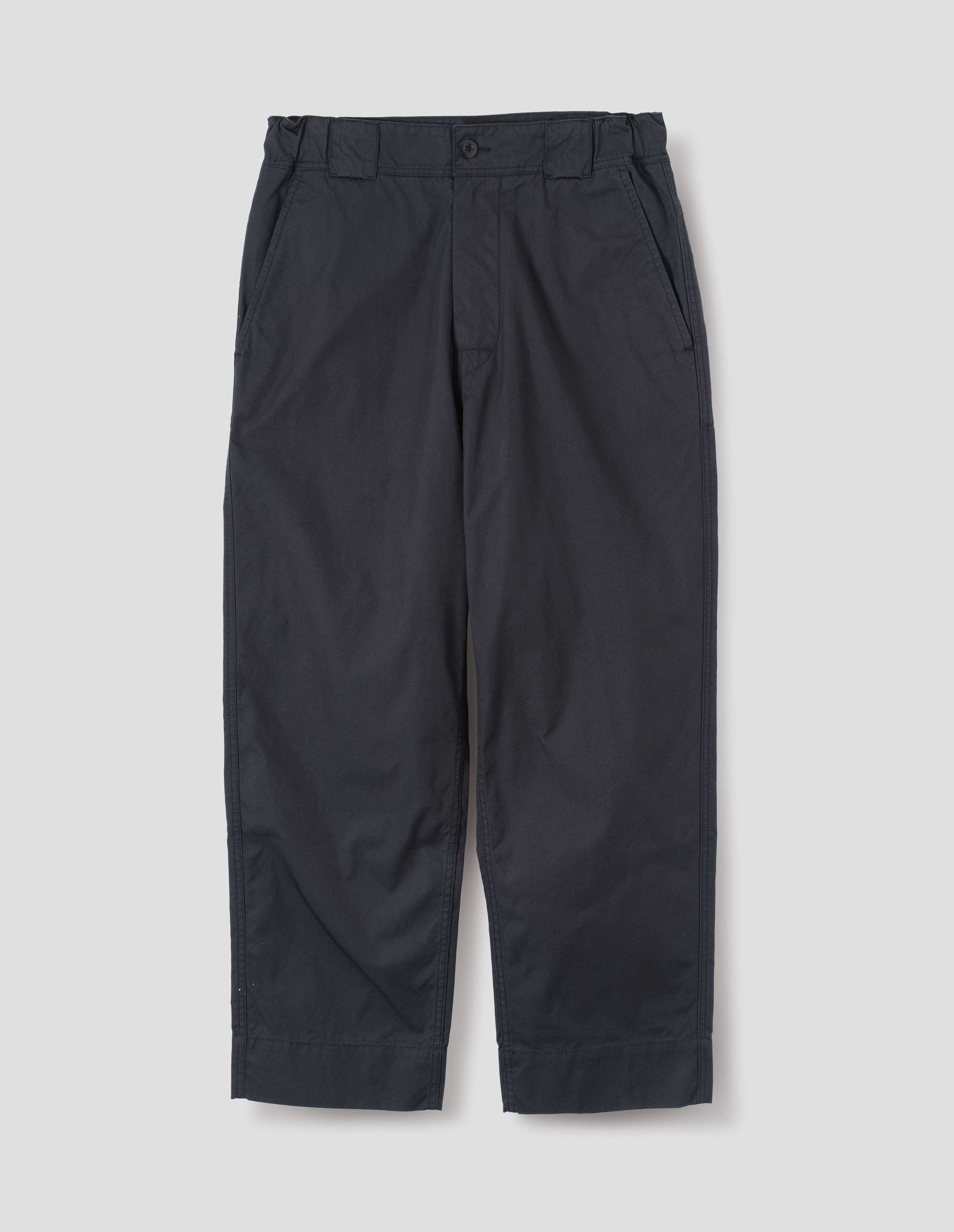 Dark navy blue trousers with tapered leg, button fastening, side elasticated waistband, wide belt loops and deep hem. Front flat lay view.