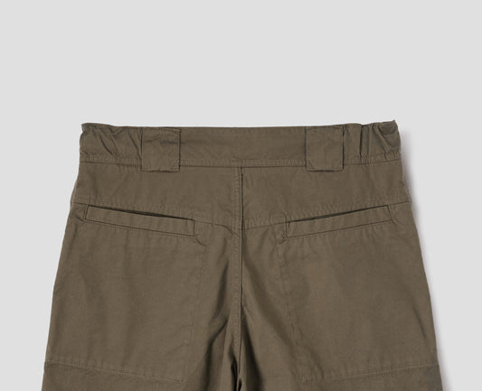 Brownish green trousers with elasticated waistband, wide belt loops and stitch through welt pockets on the back yoke. Back flat lay view.