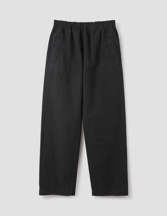 Black joggers with elasticated waist and deep welt pockets. Front flat lay view.
