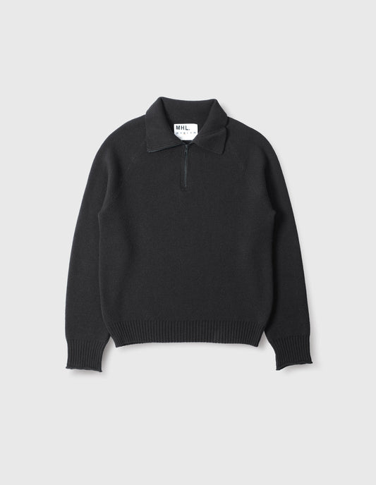 Black wool cotton zip up polo jumper, with contrast zip on collar, raglan sleeve and contrast rib on cuffs and hem. Front flat lay view.