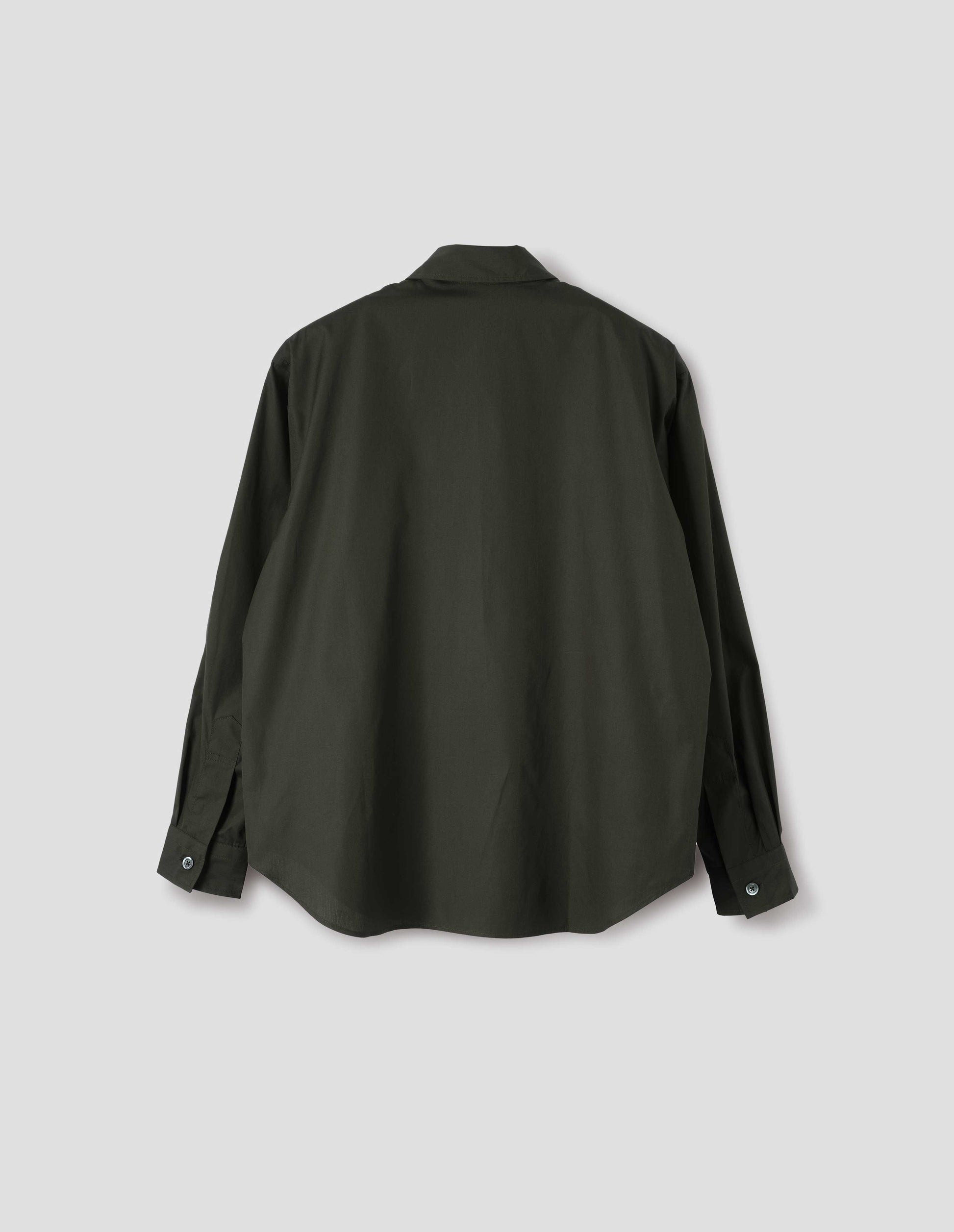 Dark green cotton poplin long sleeve shirt, with horn button closure on cuffs and curved hem. Back flat lay view. 