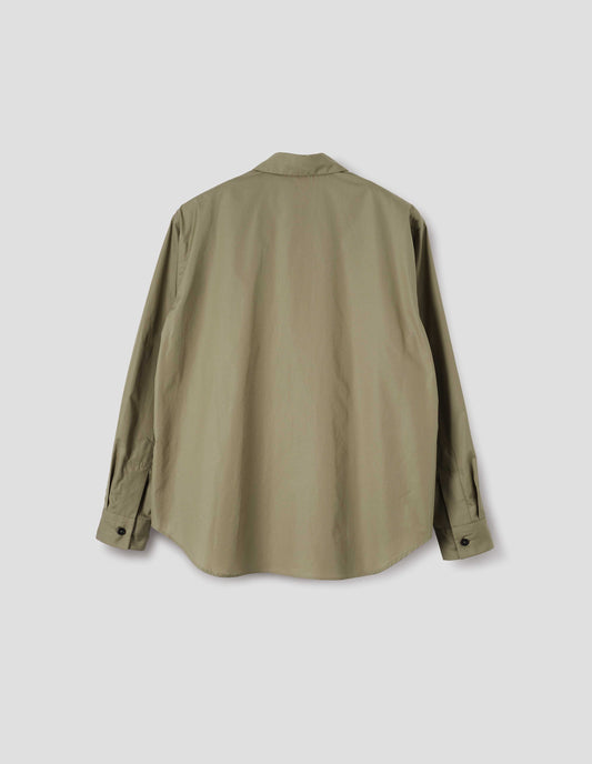 Beige cotton poplin long sleeve shirt, with horn button closure on cuffs and curved hem. Back flat lay view. 
