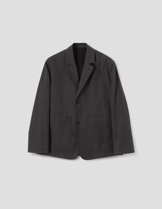 Greyish brown blazer with horn button fastening, patch pockets, contrast lining and hanger loop on inside collar. Front flat lay view. 