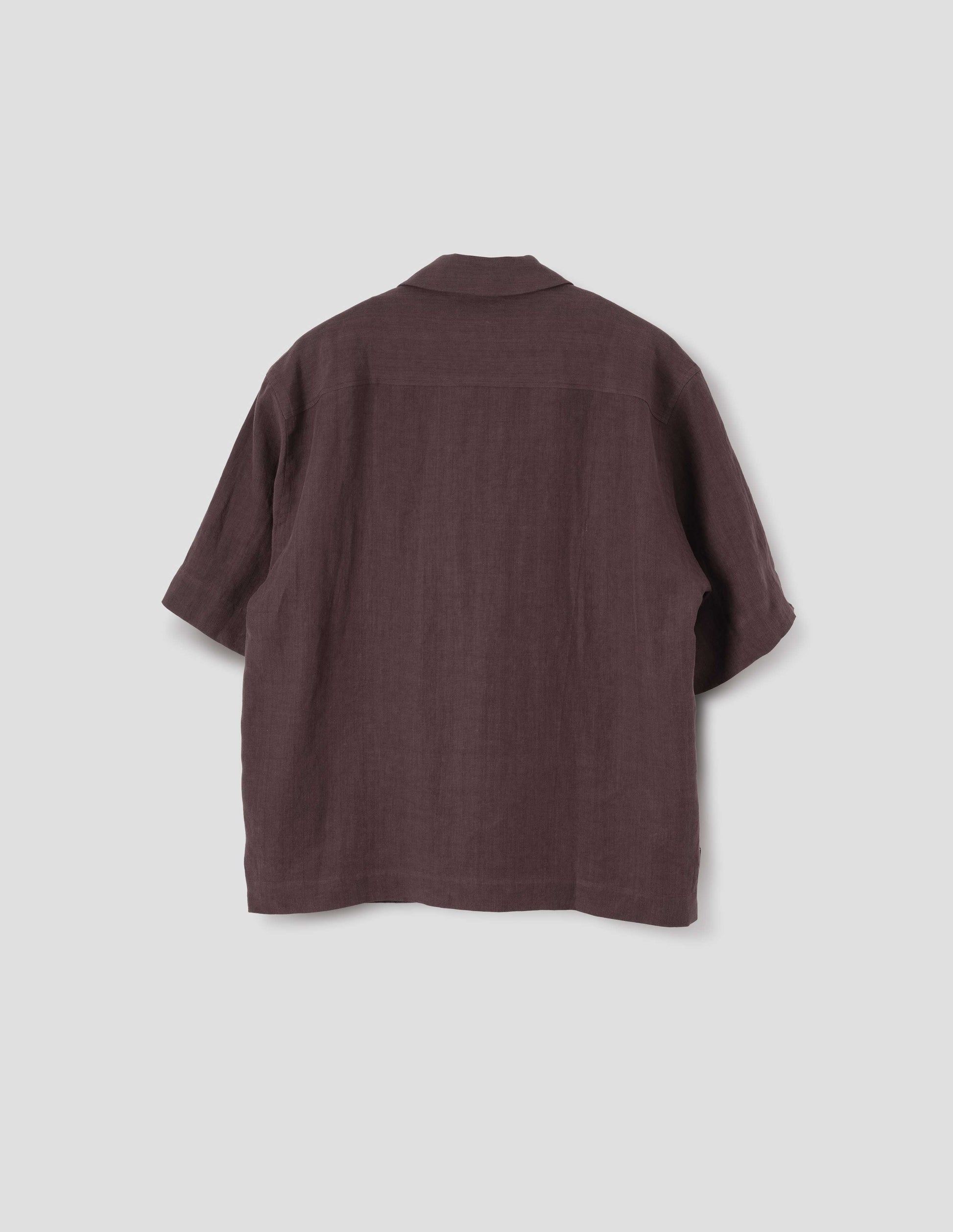 Brown short-sleeve shirt with side split hem. Back flat lay view.
