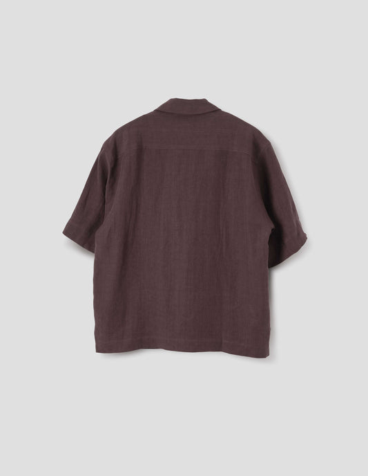 Brown short-sleeve shirt with side split hem. Back flat lay view.