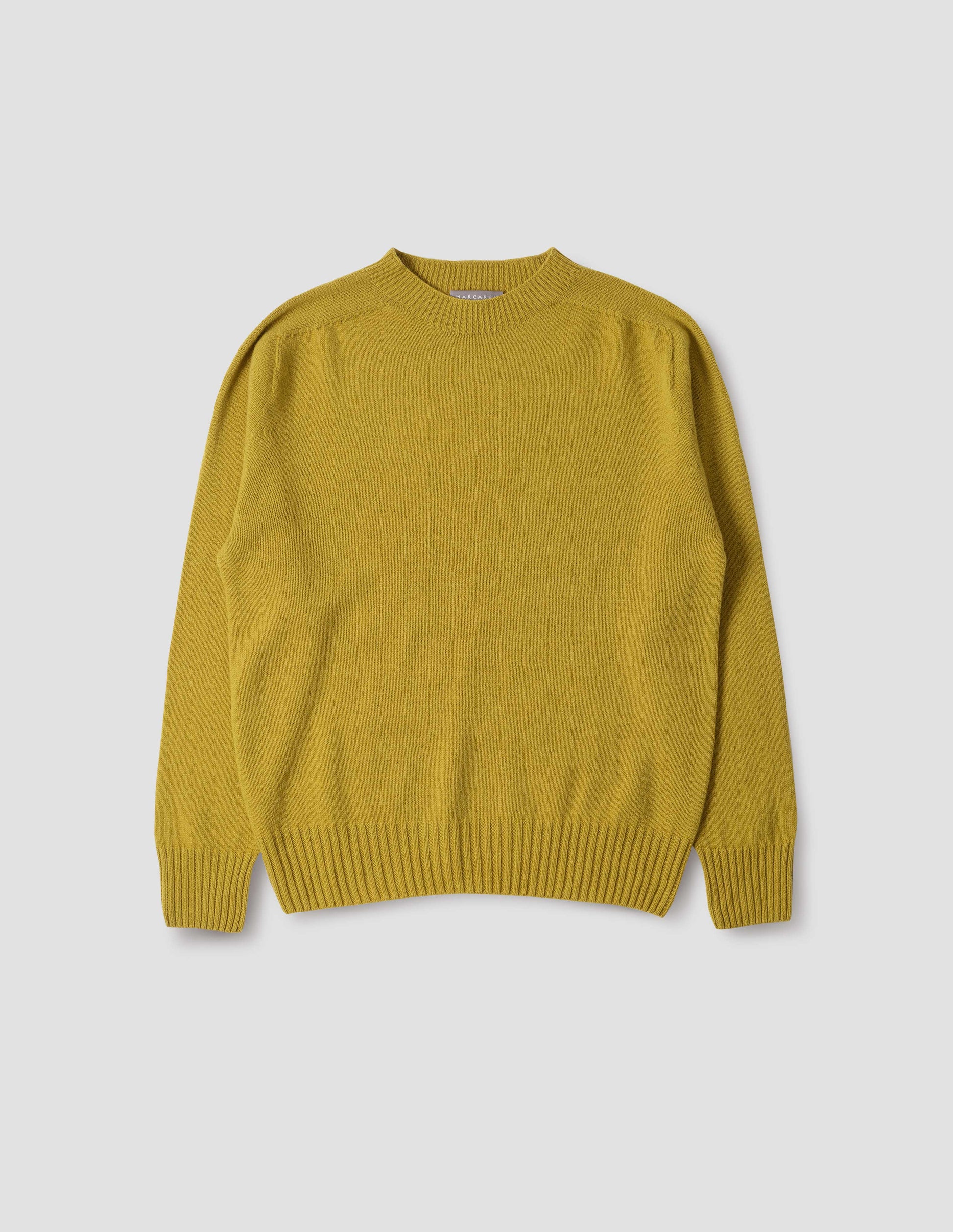 Yellow crew neck jumper with seamless finish and contrast ribs on neck, cuffs and hem. Front flat lay view.