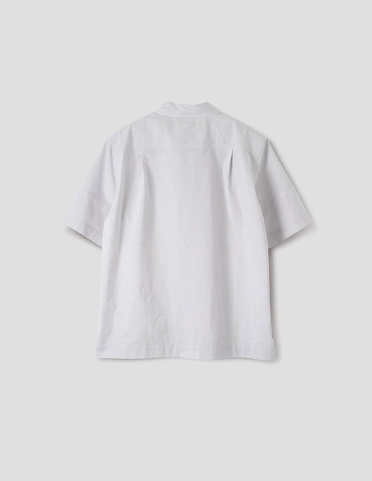 White shirt with grey stripes, panels on short sleeves with contrasting band at cuff and side split vents. Back flat way view.
