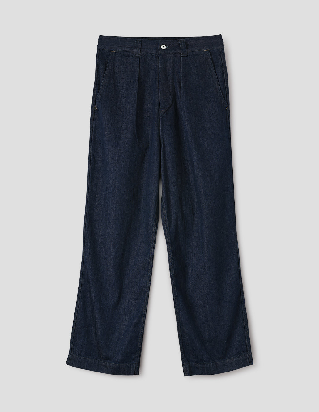 Dark blue pleated denim twill trousers with wide straight leg, high waist, metal button fly and belt loops, and curved slant pockets. Front flat lay view.