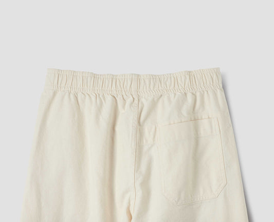 White joggers with elasticated waist and patch back pocket with stitch-through detailing. Back flat lay view.