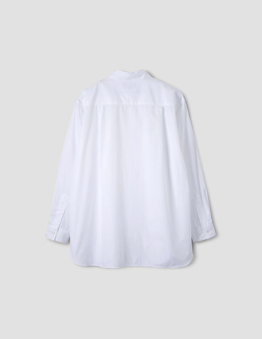 White cotton shirt, with curved hem, pleats on back yoke and mother of pearl button cuffs. Back flat lay view.