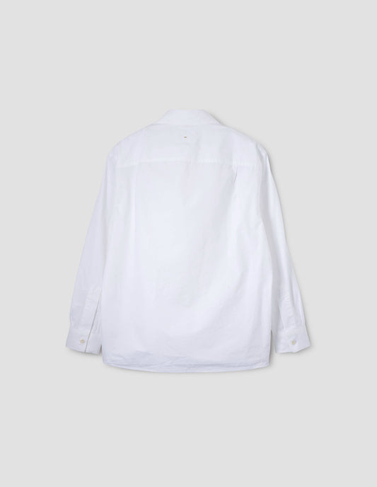 White shirt with pleats on back yoke and corozo brace buttons on cuffs. Back flat lay view.