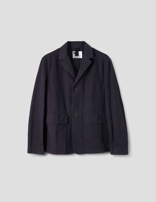 Indigo blue twill blazer with corozo button fastening lapel, stitch through chest pocket, flap patch pockets and herringbone hanger in internal back of neck. Front flat lay view.