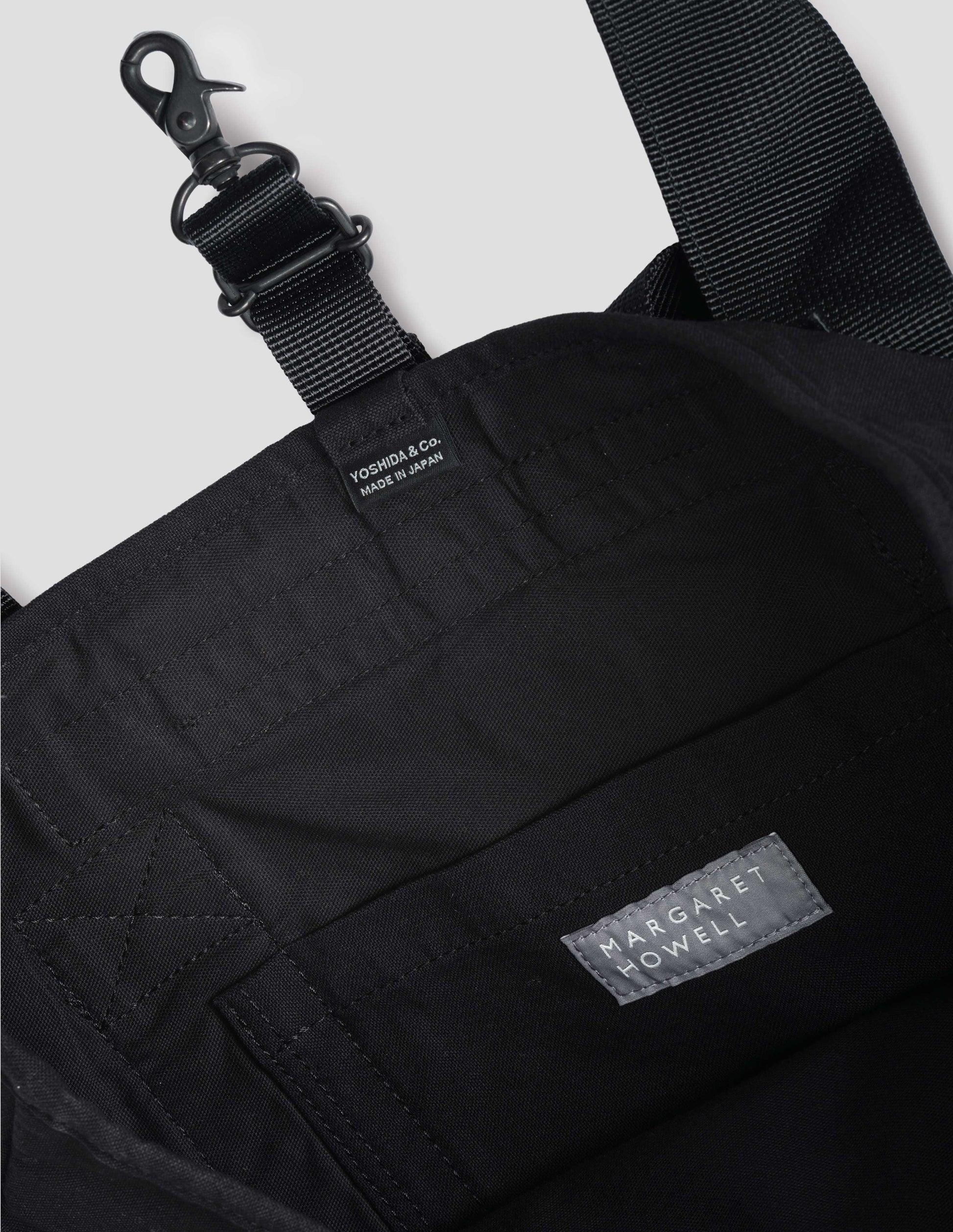 Black cotton blend backpack fabric swatch.