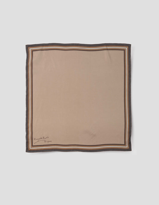 Beige square silk neck scarf with white, brown and grey contrast borders, hand rolled edges and Margaret Howell logo. Front flat lay view.