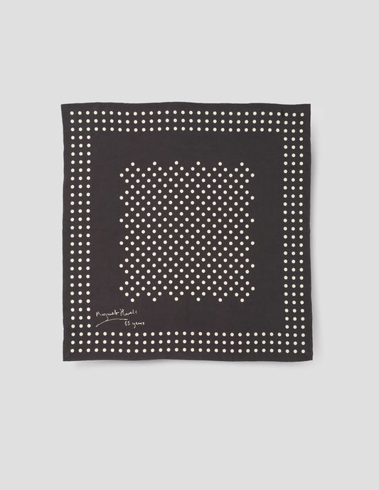 Black square silk neck scarf with white dots, hand rolled edges and Margaret Howell logo. Front flat lay view.