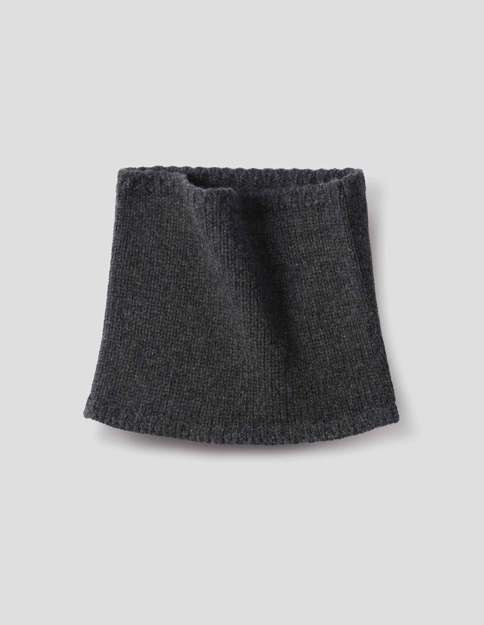Dark grey merino cashmere knitted neck warmer with contrasting rib tipping. Front flat lay view.