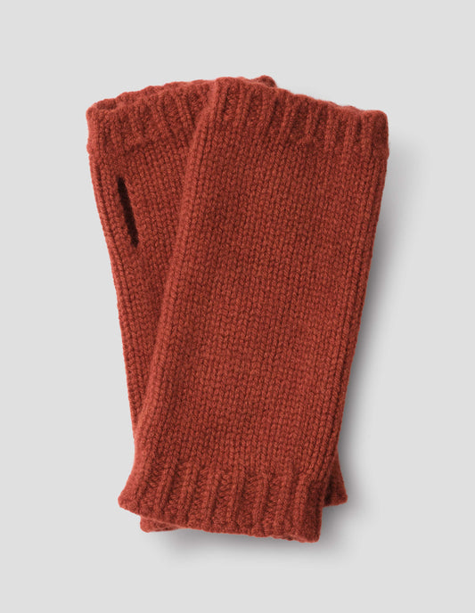 Red knitted merino cashmere wrist warmers with thumb loop and contrasting rib tipping.