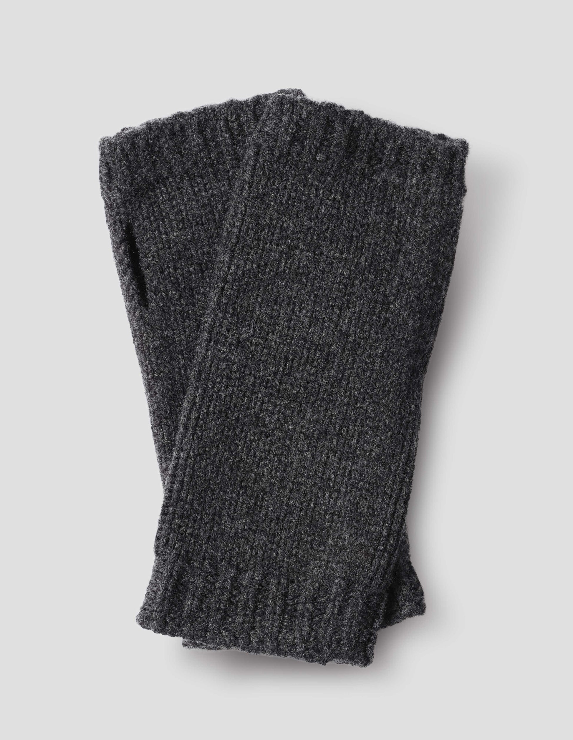 Dark grey knitted merino cashmere wrist warmers with thumb loop and contrasting rib tipping.