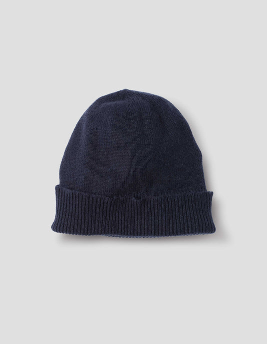 Navy blue cashmere beanie with contrast rib turn back rim, front flat lay view.