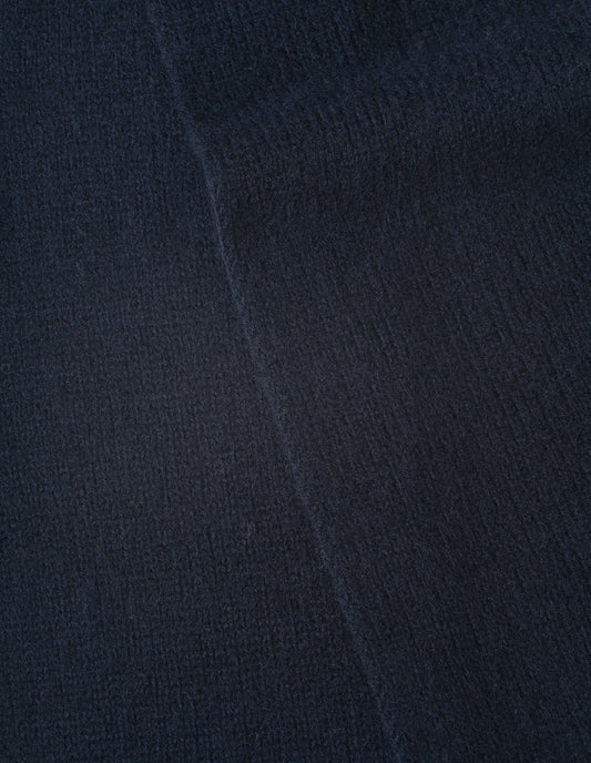 Dark navy blue knitted wool scarf, fabric swatch.