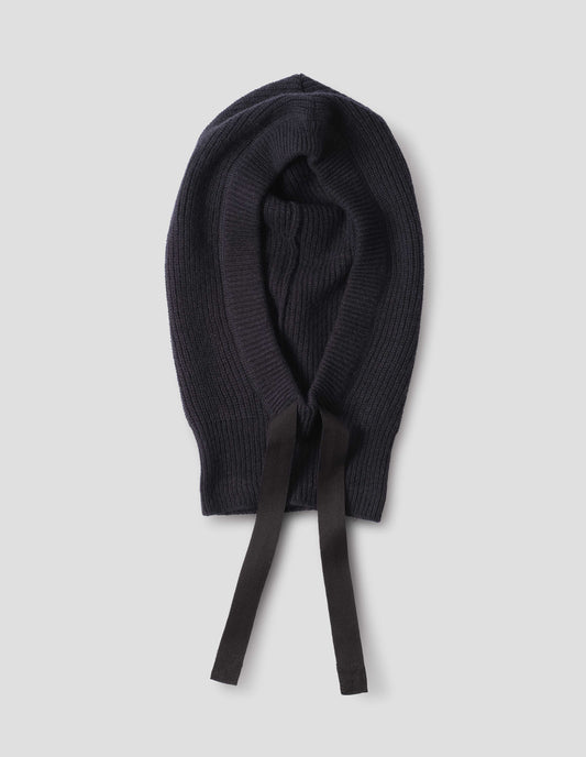 Dark navy blue wool hood with contrasting black herringbone tape to adjust and contrast rib on face, front flat lay view.