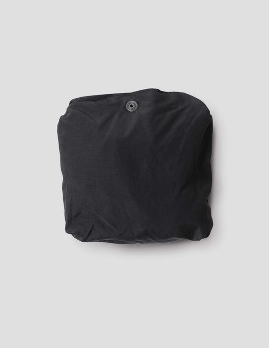 Black proofed cotton cotton bag in packable pocket pouch. 