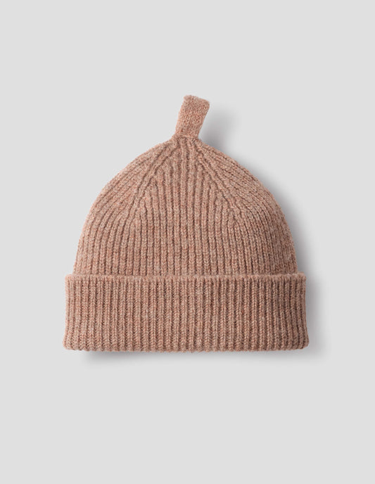 Pinkish beige wool ribbed hat, with knitted loop detailing on top, front flat lay view. 