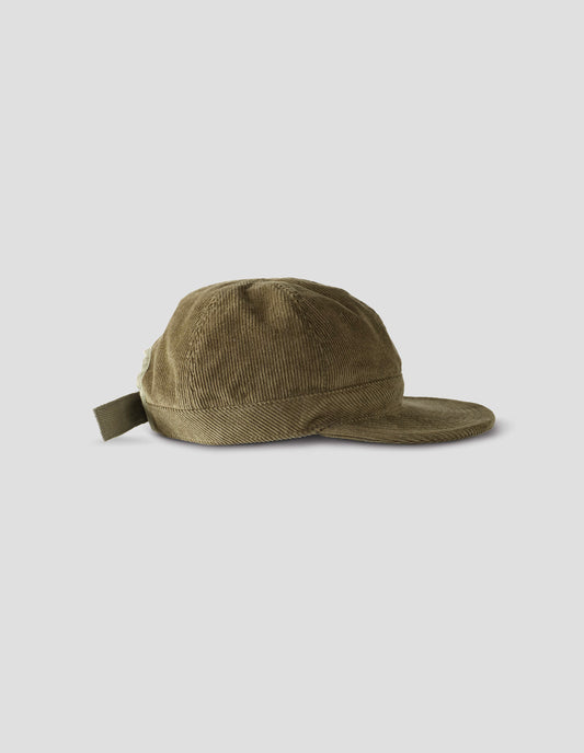 Khaki beige corduroy cap, with herringbone tape adjuster, side view flat lay.
