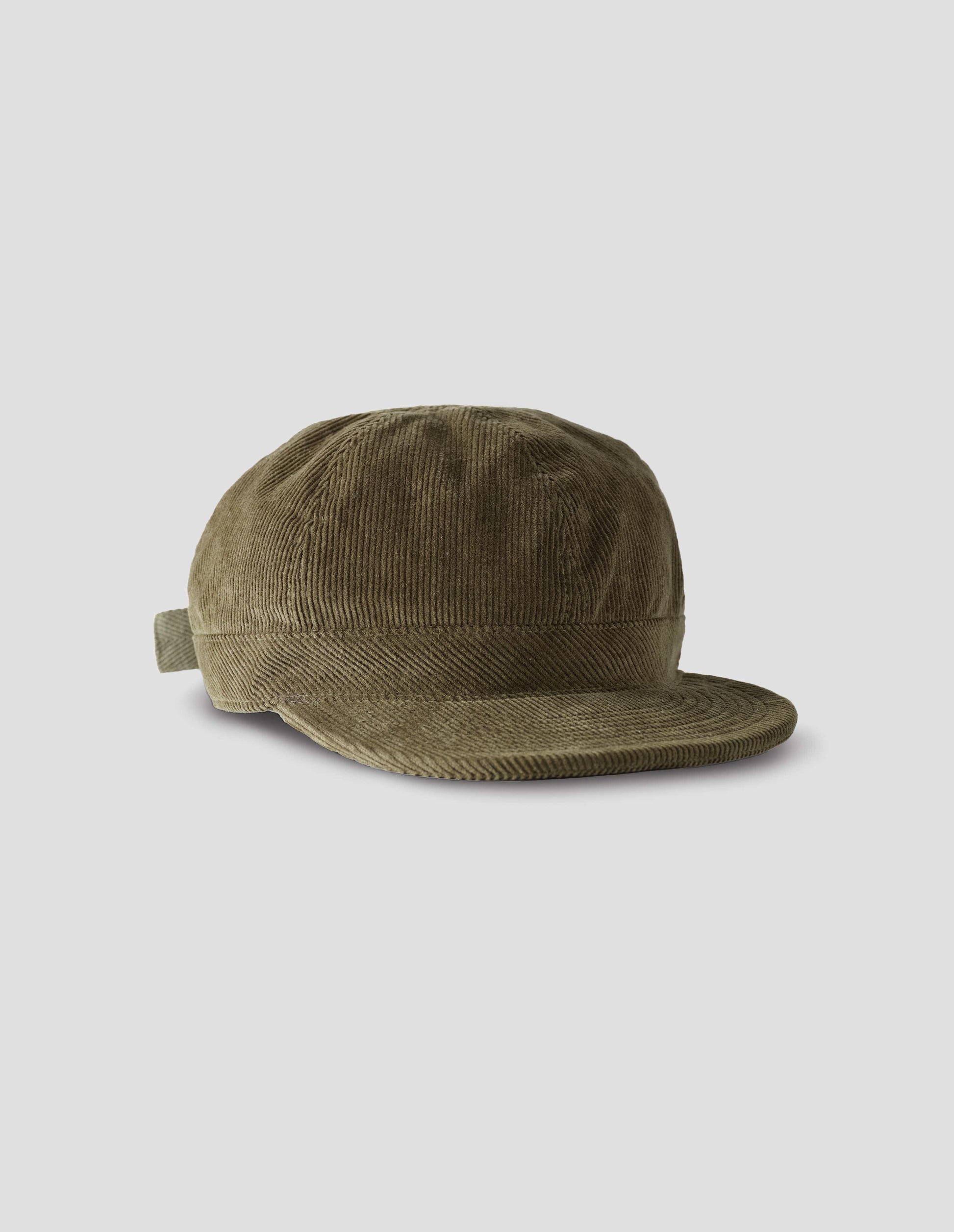 Khaki beige corduroy cap, with herringbone tape adjuster, front flay lay view.