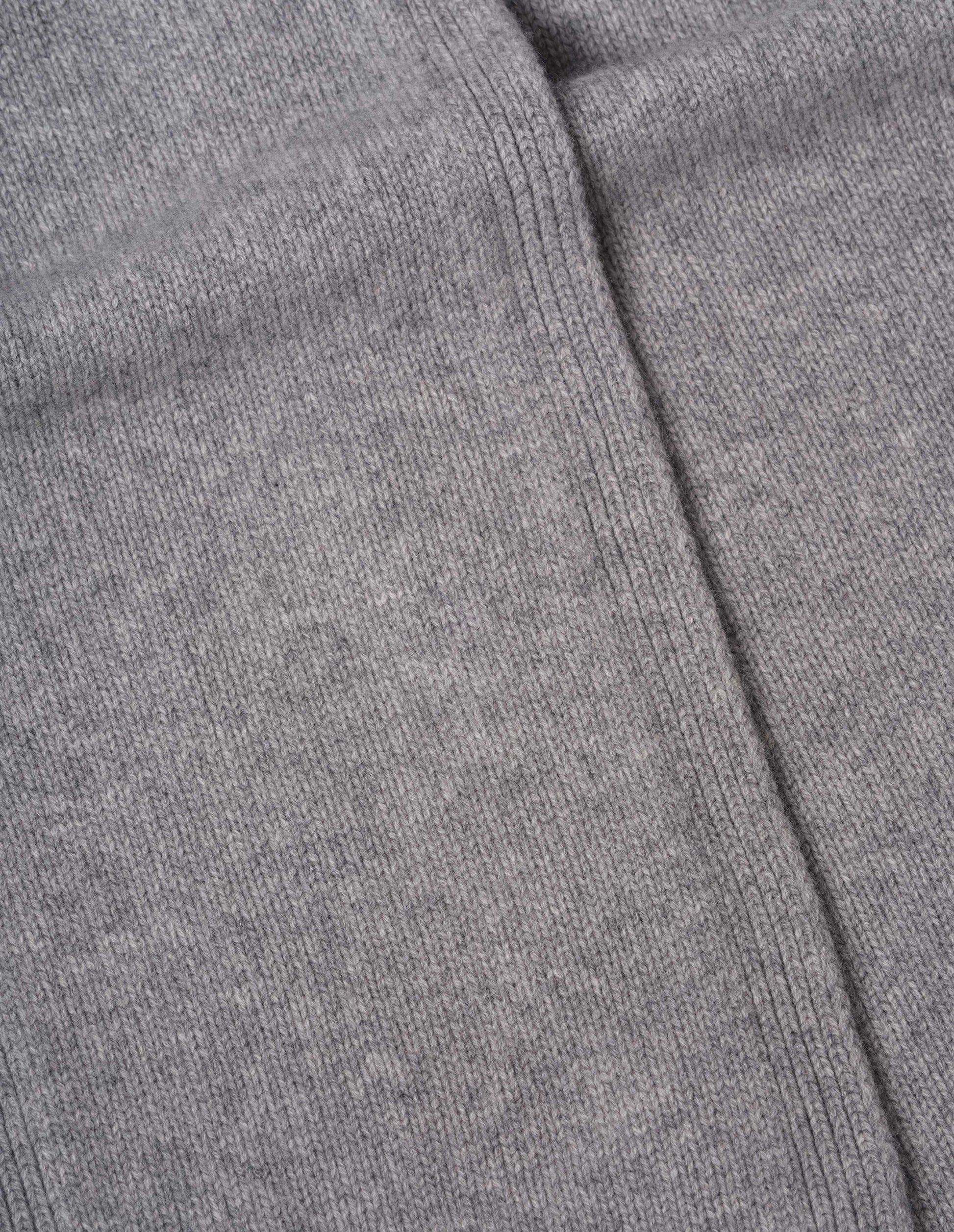 Light grey knitted cashmere scarf, fabric swatch.